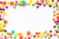 Assorted sweets and marmalade frame on white background top view space for text Royalty Free Stock Photo