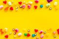Assorted sweets and marmalade frame on yellow background top view space for text Royalty Free Stock Photo