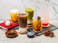 Assorted Taiwan iced tea Oolong milk Latte, Green tea latte, Strawberry Lemon tea, ice Oreo milk tea, served in disposable glass Royalty Free Stock Photo