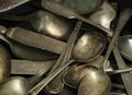 Assorted tarnished antique spoons and knives Royalty Free Stock Photo