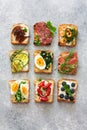 Assorted toasts with eggs, ham ,vegetables and fruits served on Royalty Free Stock Photo