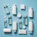 Assorted toiletry items on a blue background include clear bottles with flip caps Royalty Free Stock Photo
