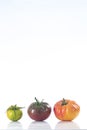 Assorted tomatoes heirloom isolated on white Royalty Free Stock Photo