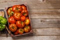 Assorted tomatoes in rustic crate