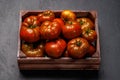 Assorted tomatoes in rustic crate