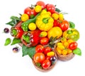 Assorted tomatoes and vegetables isolated on white background. Photo for your design Royalty Free Stock Photo