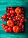 Assorted tomatoes in wooden box