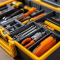 Assorted tools are organized in a yellow toolbox.hardware equipment Royalty Free Stock Photo