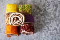 Assorted traditional Turkish sweets on a grey concrete background. Southwest Asian Dish Royalty Free Stock Photo