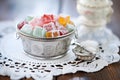 assorted turkish delight in a traditional silver bowl with a lace doily