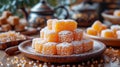 Assorted Turkish delights dusted with icing sugar on a wooden serving board. Concept of traditional Turkish confections