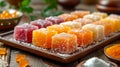 Assorted Turkish delights dusted with icing sugar on a wooden serving board. Concept of traditional Turkish confections