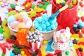 Assorted variety of sweet sugar candies includes, gummy bears, gum balls and sugar fruit slices Royalty Free Stock Photo