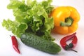 Assorted vegetables, fresh bell pepper, tomato, chilli pepper, cucumber and lettuce isolated on white background Royalty Free Stock Photo