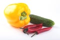 Assorted vegetables, fresh bell pepper, tomato, chilli pepper, cucumber and lettuce on white background Royalty Free Stock Photo