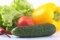 Assorted vegetables, fresh bell pepper, tomato, chilli pepper, cucumber and lettuce on white background Royalty Free Stock Photo