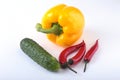 Assorted vegetables, fresh bell pepper, tomato, chilli pepper, cucumber and lettuce on white background Royalty Free Stock Photo