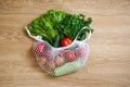 Assorted vegetables in grocery mesh string bag. Zero waste, plastic free, Eco friendly concept Royalty Free Stock Photo