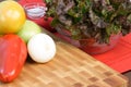 Assorted veggies on fine wood cuttingboard Royalty Free Stock Photo