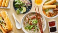 Assorted vietnamese dishes with pho, bahn mi, spring rolls in top down composition Royalty Free Stock Photo