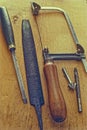 Assorted Vintage Working tools on old wooden Background Lokgram Kalyan