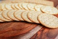Assorted Whole Grain and Herb Crackers on a Wooden Cutting Board Royalty Free Stock Photo