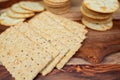 Assorted Whole Grain and Herb Crackers on a Wooden Cutting Board Royalty Free Stock Photo