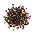 Assorted whole peppercorns in a vibrant and colorful display against a plain background Royalty Free Stock Photo