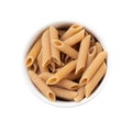 Assorted whole wheat pasta on bowls over wooden table Royalty Free Stock Photo