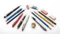 Assorted writing instruments and erasers on white background Royalty Free Stock Photo