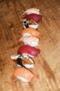 Assortie sushi nigiri tuna unagi shrimp salmon on wooden background