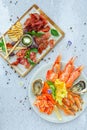 Assortment of antipasti, different meat and various shrimps plate, restaurant menu