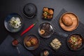 Asian cuisine, gourmet food setting, top view black background