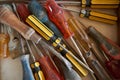 Assortment of awls and screwdrivers in a toolkit drawer