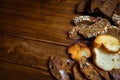 Assortment of baked bread on wooden table background