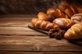 Assortment of baked bread and bread rolls, loaves, buns, pastry on rustic black bakery table counter, copy space Royalty Free Stock Photo