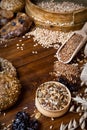 Assortment of baked bread on wooden table background