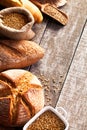 Assortment of baked bread on wooden table background Royalty Free Stock Photo