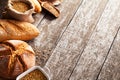Assortment of baked bread on wooden table background Royalty Free Stock Photo