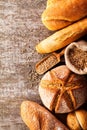 Assortment of baked bread on wooden table background Royalty Free Stock Photo