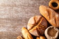 Assortment of baked bread on wooden table background Royalty Free Stock Photo