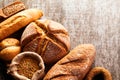 Assortment of baked bread on wooden table background Royalty Free Stock Photo