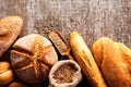 Assortment of baked bread on wooden table background Royalty Free Stock Photo