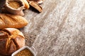 Assortment of baked bread on wooden table background Royalty Free Stock Photo