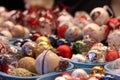 Assortment of balls toys for the Christmas tree in baskets in store