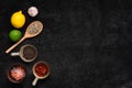 Assortment of basic spice on black stone background