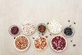 Assortment of beans on a stone background. Crimson cranberry, red, painted pony, black turtle, brown, black-eyed, Jacob`s Cattle Royalty Free Stock Photo