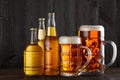 Assortment of beer glasses and bottles on table Royalty Free Stock Photo