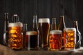 Assortment of beer glasses on table with burlap cloth Royalty Free Stock Photo