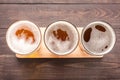 Assortment of beer glasses on a wooden background. Top view Royalty Free Stock Photo